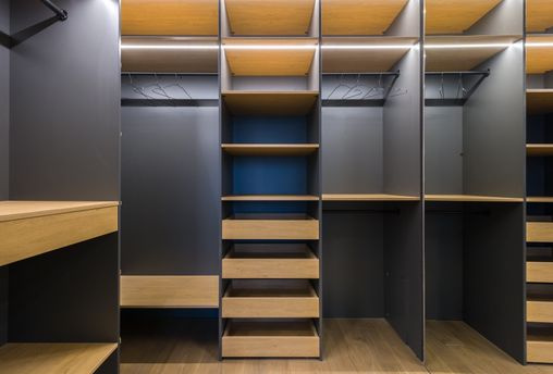 built in wardrobe with open doors and shelves