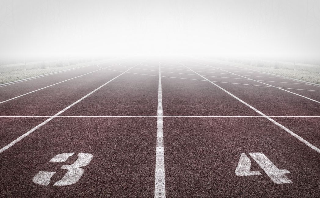 empty running track in morning light