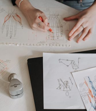 designer sketching logo concepts on paper