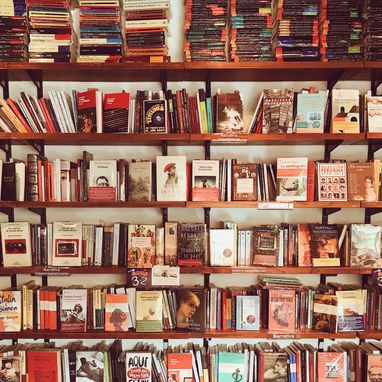 law books on a wooden shelf