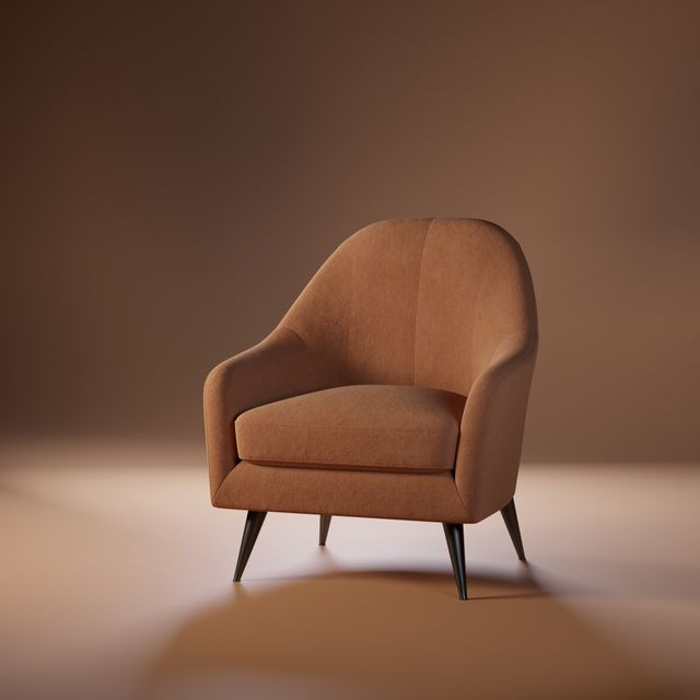 single empty chair on a stage under a spotlight