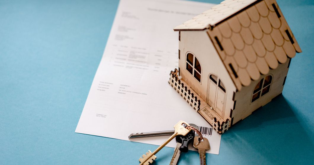 house keys on a signed property contract