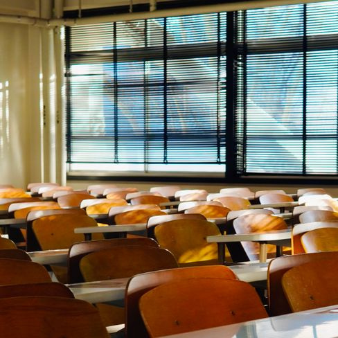 empty classroom with desks and whiteboard