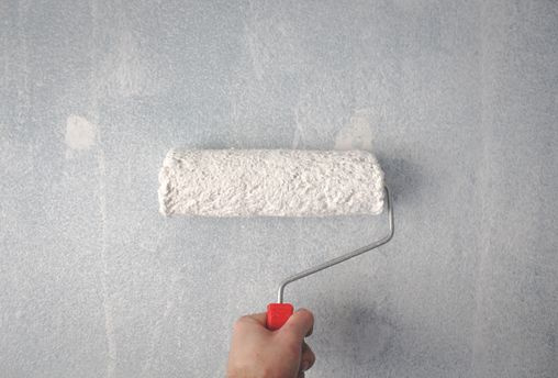 painter roller painting interior wall