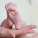 newborn baby feet wrapped in blanket