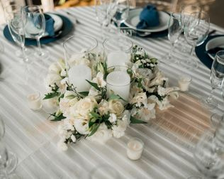 wedding reception table with candles and flowers