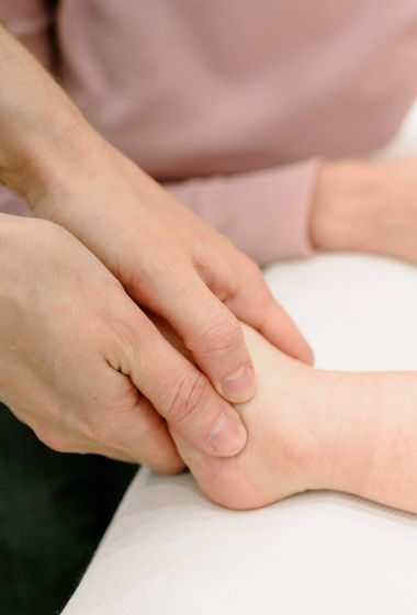 podiatrist examining foot