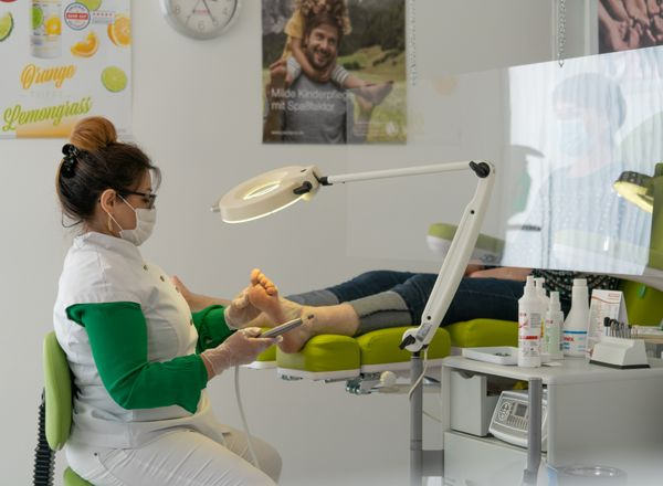 podiatrist examining foot