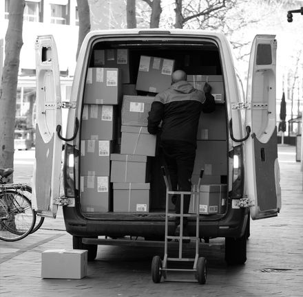 movers loading truck boxes