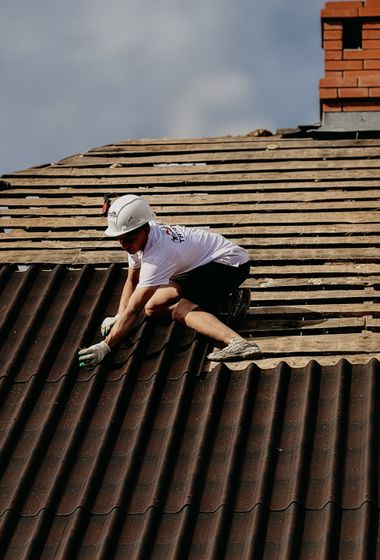 roofer working on tiled roof