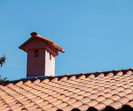 new terracotta tile roof blue sky