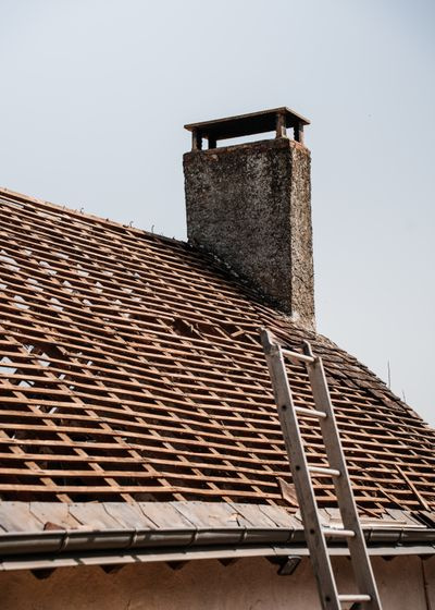 roofer working on tiled roof