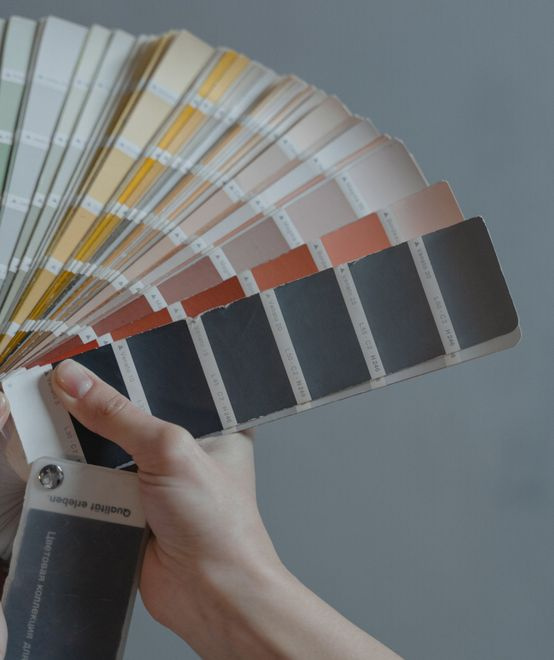 paint colour swatch samples fanned on a table