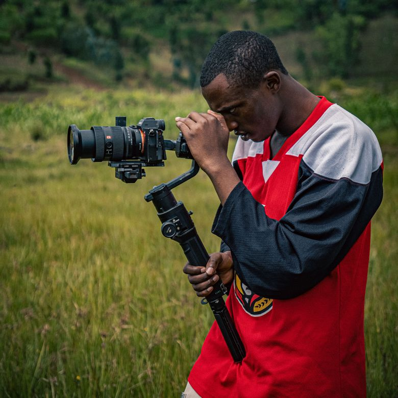 videographer filming with camera on gimbal stabilizer