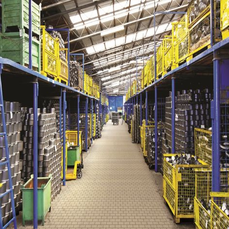 stacked cardboard boxes on a warehouse trolley