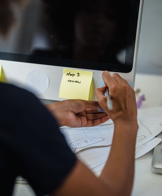 desk with sticky notes and a hand drawn sitemap