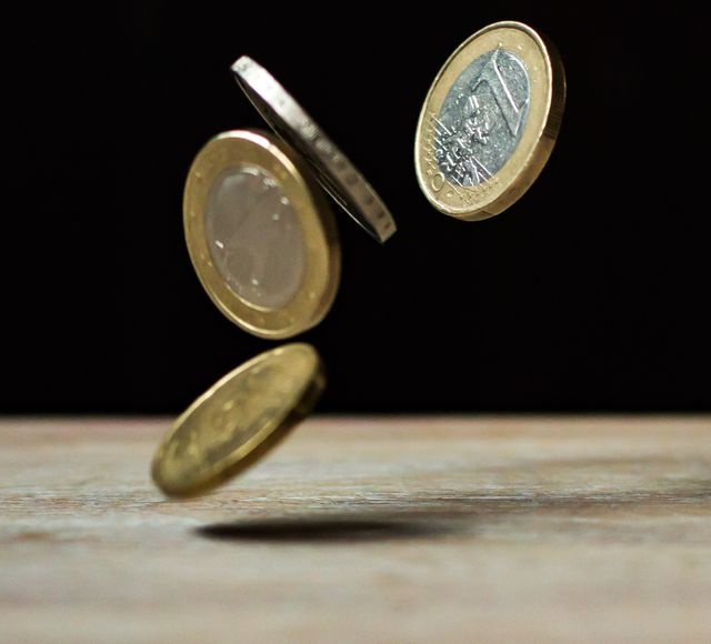 stacked gold coins on dark background
