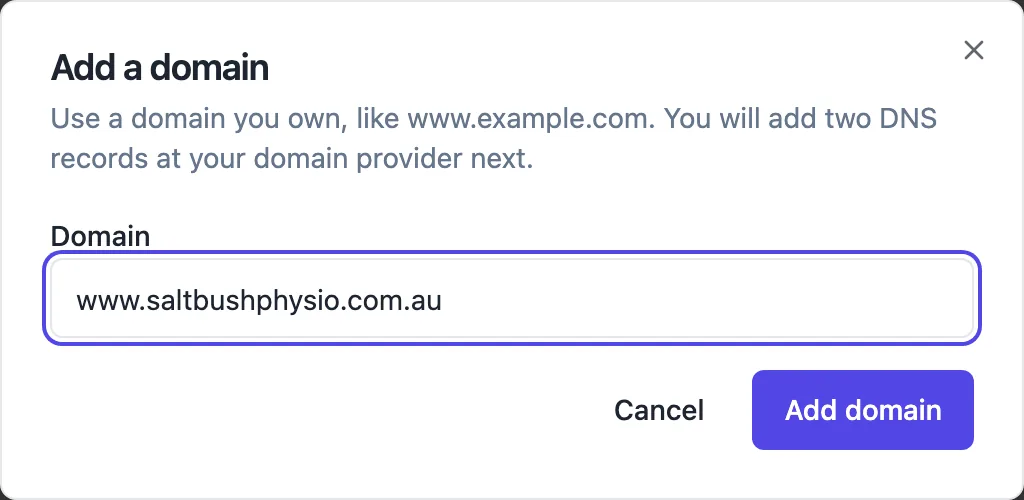 The Add a domain dialog with the hostname www.saltbushphysio.com.au typed in, the note that you will add two DNS records at your domain provider next, and Cancel and Add domain buttons